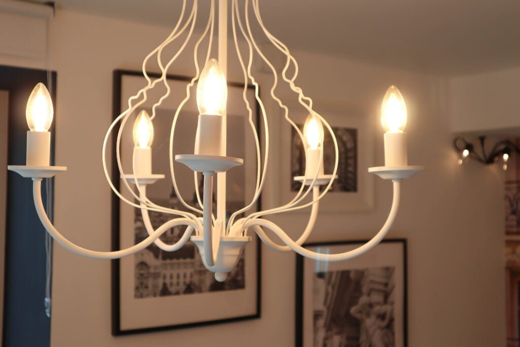 Dining area with elegant chandelier in Szentendre apartment